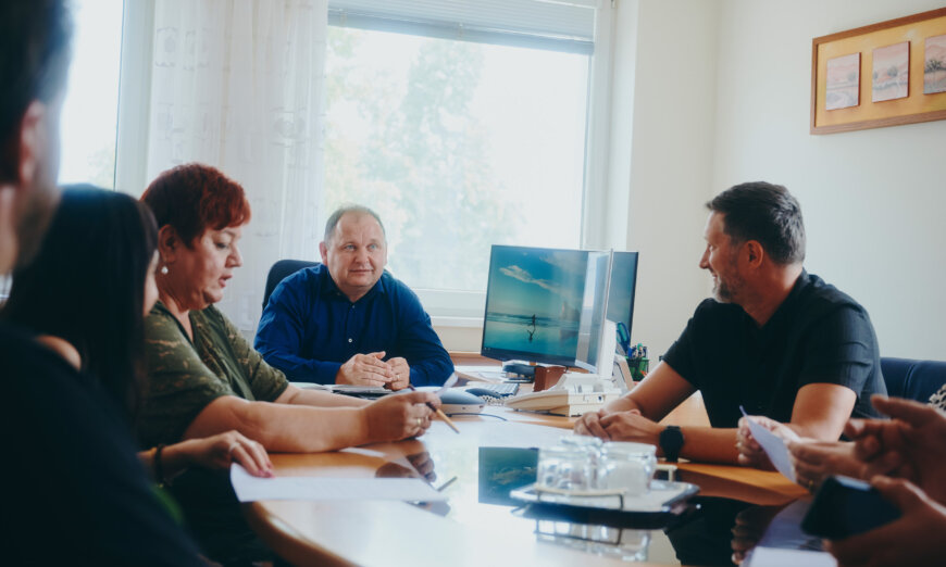 moll-rail-slowakia-team-sitting-around-table-during-business-meeting-in-office